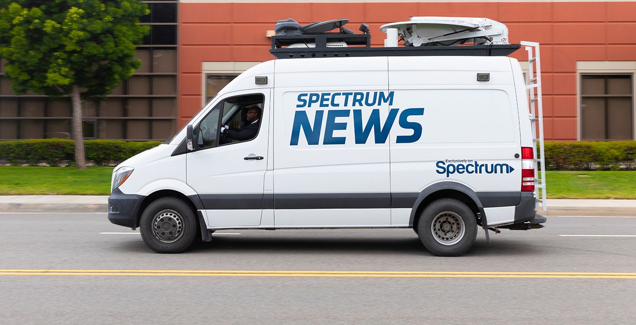 Spectrum News van on the road