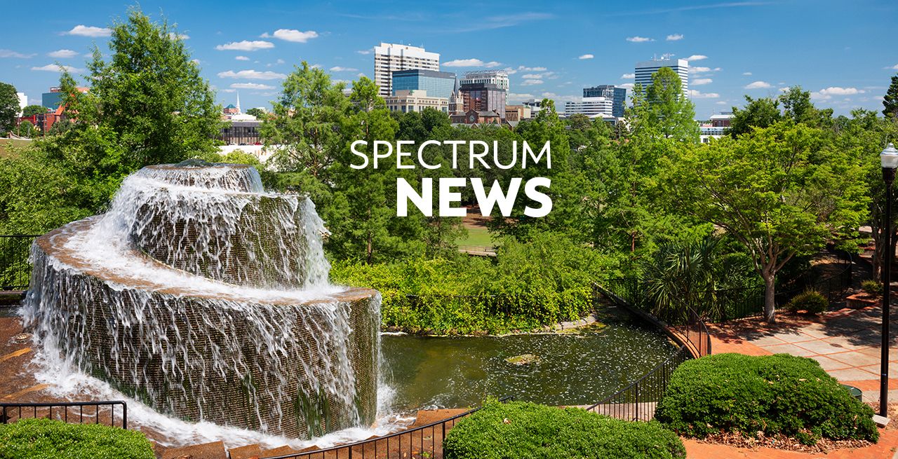 Scene from downtown Columbia, S.C.. showing a fountain with cityscape